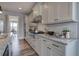 Well-lit kitchen with modern stainless steel appliances, gray cabinets, and light granite countertops at 64 Roberson Ne Dr, Cartersville, GA 30121