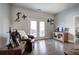 Cozy living room with hardwood floors, a leather recliner, and double doors opening to an outdoor patio at 64 Roberson Ne Dr, Cartersville, GA 30121