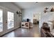 Inviting living room featuring hardwood floors, a view to the outdoor patio, and an adjacent bedroom at 64 Roberson Ne Dr, Cartersville, GA 30121