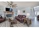 Cozy living room featuring a stone fireplace, wood mantel, and stylish decor at 64 Roberson Ne Dr, Cartersville, GA 30121