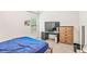 Bedroom featuring a desk area, comfortable bed, and a neutral color palette at 2167 Dodson Woods Dr, Fairburn, GA 30213