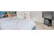 Bright bedroom featuring a cozy bed, TV, and a neutral color scheme at 2167 Dodson Woods Dr, Fairburn, GA 30213