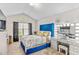 Bedroom boasting a stylish vanity, plush blue bed, and cozy carpet, perfect for relaxation and comfort at 2167 Dodson Woods Dr, Fairburn, GA 30213