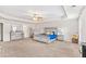 Spacious bedroom with plush carpet, stylish furniture, and tray ceilings, creating a luxurious and inviting atmosphere at 2167 Dodson Woods Dr, Fairburn, GA 30213