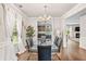 Bright dining room with hardwood floors, chandelier, and seamless flow to other living areas at 2167 Dodson Woods Dr, Fairburn, GA 30213