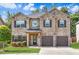 Charming two-story brick home with a well-manicured lawn and attached two-car garage at 2167 Dodson Woods Dr, Fairburn, GA 30213
