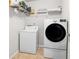 Functional laundry room with modern appliances and ample storage space at 2167 Dodson Woods Dr, Fairburn, GA 30213