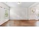 Spacious living room with hardwood floors, neutral paint, and ample natural light at 2167 Dodson Woods Dr, Fairburn, GA 30213