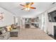 Open-concept living area connects the kitchen, living room, and dining area, perfect for gatherings at 2167 Dodson Woods Dr, Fairburn, GA 30213