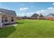 Large, well-maintained backyard with lush green grass, great for outdoor activities at 219 Prominent Loop, Mcdonough, GA 30253