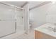 Bathroom with a stand-up shower, double sink vanity, and a decorative wallpaper border at 219 Prominent Loop, Mcdonough, GA 30253