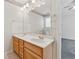 Bathroom featuring a double sink vanity, mirror, and access to the bedroom at 219 Prominent Loop, Mcdonough, GA 30253