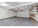 Spacious garage featuring a ceiling fan, work bench and storage at 219 Prominent Loop, Mcdonough, GA 30253