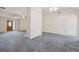 Bright living area showcasing neutral walls, stylish paneling, and soft carpeting, perfect for relaxation and gatherings at 219 Prominent Loop, Mcdonough, GA 30253
