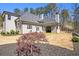 Backyard view of the home with a garden bed, and a view of the surrounding woods at 3141 Buck Branch Sw Rd, Conyers, GA 30094