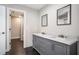 Bathroom featuring double sinks with marble countertops, modern fixtures, and mirrors at 3141 Buck Branch Sw Rd, Conyers, GA 30094