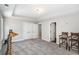 Large bedroom showcases a tray ceiling, ample lighting, and an adjacent door at 3141 Buck Branch Sw Rd, Conyers, GA 30094