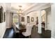 Elegant dining room with decorative chandelier and natural light at 3141 Buck Branch Sw Rd, Conyers, GA 30094
