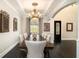 Elegant dining room showcasing a large table and chairs under a decorative chandelier at 3141 Buck Branch Sw Rd, Conyers, GA 30094