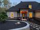 Charming home with manicured landscaping, a stone pathway, and an inviting front entrance at 3141 Buck Branch Sw Rd, Conyers, GA 30094