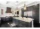 Modern kitchen boasting dark cabinetry, stainless appliances, granite countertops and tile backsplash at 3141 Buck Branch Sw Rd, Conyers, GA 30094