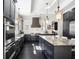 Stunning kitchen featuring dark cabinets, stainless steel appliances, and a large central island at 3141 Buck Branch Sw Rd, Conyers, GA 30094