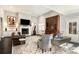 Bright living room with high ceilings, a fireplace, stylish furnishings, and lots of natural light at 3141 Buck Branch Sw Rd, Conyers, GA 30094