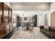 Open floor plan: living room and kitchen view featuring dark hardwood floors and elegant furnishings at 3141 Buck Branch Sw Rd, Conyers, GA 30094