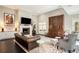 Spacious living room with fireplace, mounted television, elegant furnishings and built in cabinets at 3141 Buck Branch Sw Rd, Conyers, GA 30094