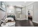 Elegant main bathroom with tiled walk-in shower, soaking tub, and modern vanity and lighting at 3141 Buck Branch Sw Rd, Conyers, GA 30094