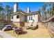 Inviting outdoor patio with stone surround, fire pit and comfortable seating, perfect for relaxing at 3141 Buck Branch Sw Rd, Conyers, GA 30094