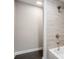 Modern shower featuring tiled walls and a rainfall shower head for a luxurious experience at 3141 Buck Branch Sw Rd, Conyers, GA 30094