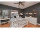 Stylish bedroom featuring a white metal bed frame and dark painted walls at 9445 Grande Dr, Winston, GA 30187