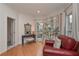 Cozy sitting area off bedroom with red leather chair and natural light at 9445 Grande Dr, Winston, GA 30187