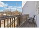 Outdoor balcony featuring a chair and wooden railing overlooking the neighborhood at 2000 Ocean Nw Dr, Atlanta, GA 30318