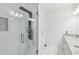 Sleek bathroom featuring a tiled shower with a rain shower head and body jets at 2000 Ocean Nw Dr, Atlanta, GA 30318