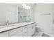 Bathroom with double granite vanity, modern lighting, and a glass enclosed shower at 2000 Ocean Nw Dr, Atlanta, GA 30318