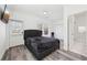 Comfortable bedroom featuring a gray upholstered bed, a closet, and an en-suite bathroom at 2000 Ocean Nw Dr, Atlanta, GA 30318