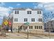 Three-story townhouse complex with a welcoming entrance and street signage at 2000 Ocean Nw Dr, Atlanta, GA 30318