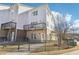 Multi-story townhouse featuring multiple balconies, a secure fence, and attractive curb appeal at 2000 Ocean Nw Dr, Atlanta, GA 30318