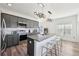 Stylish kitchen with gray cabinets, stainless appliances, granite countertops, and island with seating at 2000 Ocean Nw Dr, Atlanta, GA 30318