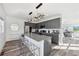 Stylish kitchen featuring gray cabinets, a granite countertop island with seating, and modern pendant lighting at 2000 Ocean Nw Dr, Atlanta, GA 30318