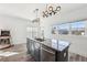Kitchen island featuring a stainless steel dishwasher and undermount sink with pendant lights above at 2000 Ocean Nw Dr, Atlanta, GA 30318