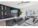 Modern living room with a large gray sectional, mounted TV, and stylish decor at 2000 Ocean Nw Dr, Atlanta, GA 30318