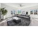 Bright living room with a large sectional, modern rug, and many windows at 2000 Ocean Nw Dr, Atlanta, GA 30318