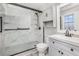 Updated bathroom featuring a new glass enclosed shower, sink, and storage cabinet at 448 Buckingham Dr, Marietta, GA 30066