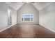 Bright bedroom with large bay window offering scenic views and hardwood flooring at 448 Buckingham Dr, Marietta, GA 30066