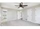 Spacious bedroom with ceiling fan, carpet, a bathroom and two closets at 448 Buckingham Dr, Marietta, GA 30066