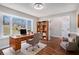 Bright home office with large bay window, hardwood floors and built-in bookcase offers a comfortable workspace at 448 Buckingham Dr, Marietta, GA 30066
