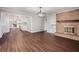 Spacious living room with a brick fireplace and views into the updated kitchen at 448 Buckingham Dr, Marietta, GA 30066